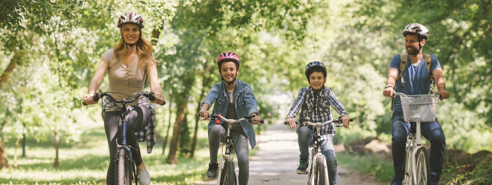 family biking in a park